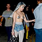 First pic of Miley Cyrus almost topless at Art Basel