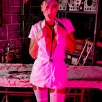Second pic of Kinky MILF nurse in white stockings over pantyhose @ PantyhoseAddict