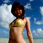 First pic of Hot Asian girl in a yellow string bikini takes it all off while walking in the clear water and showing off her hairy patch.