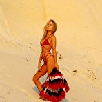 Third pic of Kimberley Garner in red bikini in desert