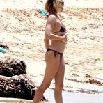 First pic of Sienna Miller in bikini on the beach