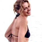 Second pic of Claudia Gerini in bikini and topless paparazzi shots