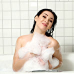 Second pic of Aria Alexander playing with hair brush in the bathtub at PinkWorld Blog
