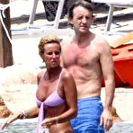 First pic of Federica Mancini caught topless on the beach