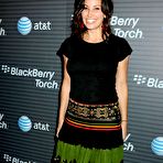 Second pic of Gina Gershon posing for paparazzi Blackberry Torch launch party