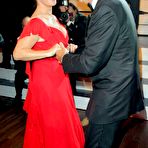 Third pic of Katarina Witt shows cleavage in long red dress