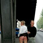 First pic of Blonde Angie in nylons, boots and mini skirt shows her bald pussy in the street