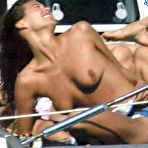 First pic of Megan Gale in bikini and topless on the beach