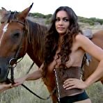 Third pic of Melita Toniolo posing topless on the horse