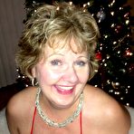 Second pic of Busty Mature Mommy Busty Bliss Poses under the Christmas Tree