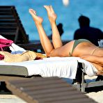 First pic of Busty Rita Rusic caught in green bikini on the beach in Miami