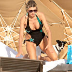 First pic of Rita Rusic shows cleavage on the beach in Miami