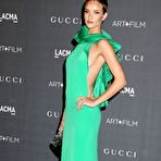Second pic of Rosie Huntington-Whiteley side of boob in green dress