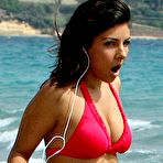 Fourth pic of Roxanne Pallett shows cleavage in red bikini on the beach