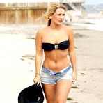 First pic of Sam Faiers in bikini top and shorts on the beach