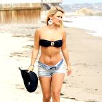Fourth pic of Sam Faiers in bikini top and shorts on the beach