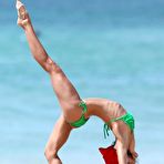 Fourth pic of Sharni Vinson sexy in green bikini aerobics on the beach in Sydney