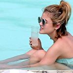 First pic of Lucy Hale in a bikini at her hotel pool