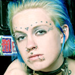 Fourth pic of Naked Rachel Face in soft chain cuffs demonstrates her tattoos and piercing