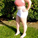 First pic of Smiling huge titted middle aged fattie Seana Rae in top and skirt poses outdoors