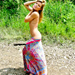 Second pic of Incredible blonde Meet Madden goes out to the lake for a softcore striptease in her long dress.