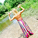 Fourth pic of Incredible blonde Meet Madden goes out to the lake for a softcore striptease in her long dress.