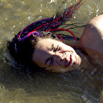 Third pic of Naked juicy titted slave girl Mallory Knots gets hogtied outdoors by the river