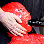 Second pic of SexPreviews - Claire Adams is bound tightly in red tape and toyed to orgasm in dungeon