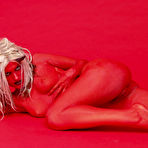 Fourth pic of Naked deviless Molly Winters with red skin and blonde hair demonstrates her snatch