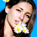 Fourth pic of Good looking brunette Rosella smelling some flowers - Snbabes.com