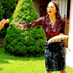 Third pic of Brunette Samantha Wow takes part in egg fight with another clothed woman in the backyard