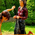 Fourth pic of Brunette Samantha Wow takes part in egg fight with another clothed woman in the backyard