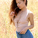 First pic of Julia Zu undresses slowly in sunny fields