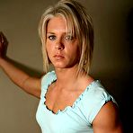 First pic of Slim blonde Kristen Curlee in white bra and blue mini skirt shows her hard muscles
