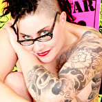 First pic of Inked up punk girl in glasses Michelle Aston fingers her shaved pussy and tight anal hole
