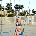Fourth pic of Inked up blonde Voltaire strips nude and goes on the swings in her bare skin
