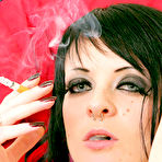 Third pic of Tattooed alt brunette Alexxa Hex with shaved pussy smokes a cigarette in the nude