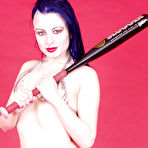 First pic of Pale skinned goth brunette Darenzia with shocking hairdo poses with baseball bat