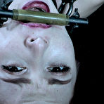 Second pic of SexPreviews - Lola Fae petite pigtails redhead is bound in metal and strapped in kinky dungeon
