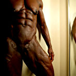 Fourth pic of Black hard body female bodybuilder Roxanne Edwards is fully nude in front of you