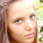 First pic of Insanely beautiful blonde teen babe Mango A poses outside in an orchard