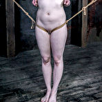 Third pic of SexPreviews - Claire Adams redhead on heels is rope spread bound and clamped in dark and kinky dungeon