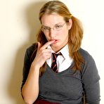 Second pic of Four-eyed school chick Kat flashes her sexy tits and pussy while posing