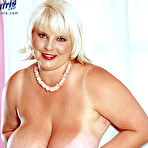First pic of White-haired fattie June Kelly touches her gigantic tits and takes metal dildo in her pussy