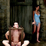 First pic of Shy Love dressed in blue nightie humiliates her slave Mini in the dungeon