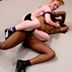 Second pic of Black wrestler Safari gets fucked from behind by her white lesbian opponent