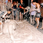 Second pic of Dionne Darling and Kia Winston get the mud wrestling started with their skirts and blouses on