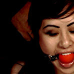 Second pic of Gagged asian Anja with her hands tied behind her back gets her exotic slit rubbed with vibrator