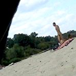 Fourth pic of Amateur nudist wife expose her perky tits on candid beach