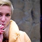 Third pic of Russian Smokers | Short cut hair blonde girl is smoking all white 120mm cigarettes